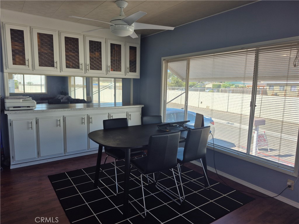 22 Magnolia Via Anaheim, CA 92801 - Photo 9 of 30 a view of a dining room with furniture a chandelier and wooden floor