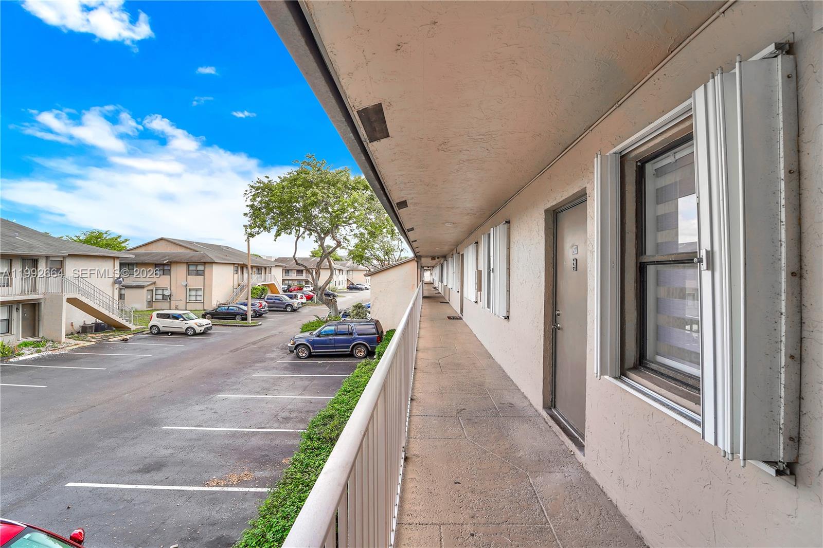 7668 Southwest 152nd Avenue, Unit 2211 Miami, FL 33193 - Photo 3 of 20 a view of a porch with seating space