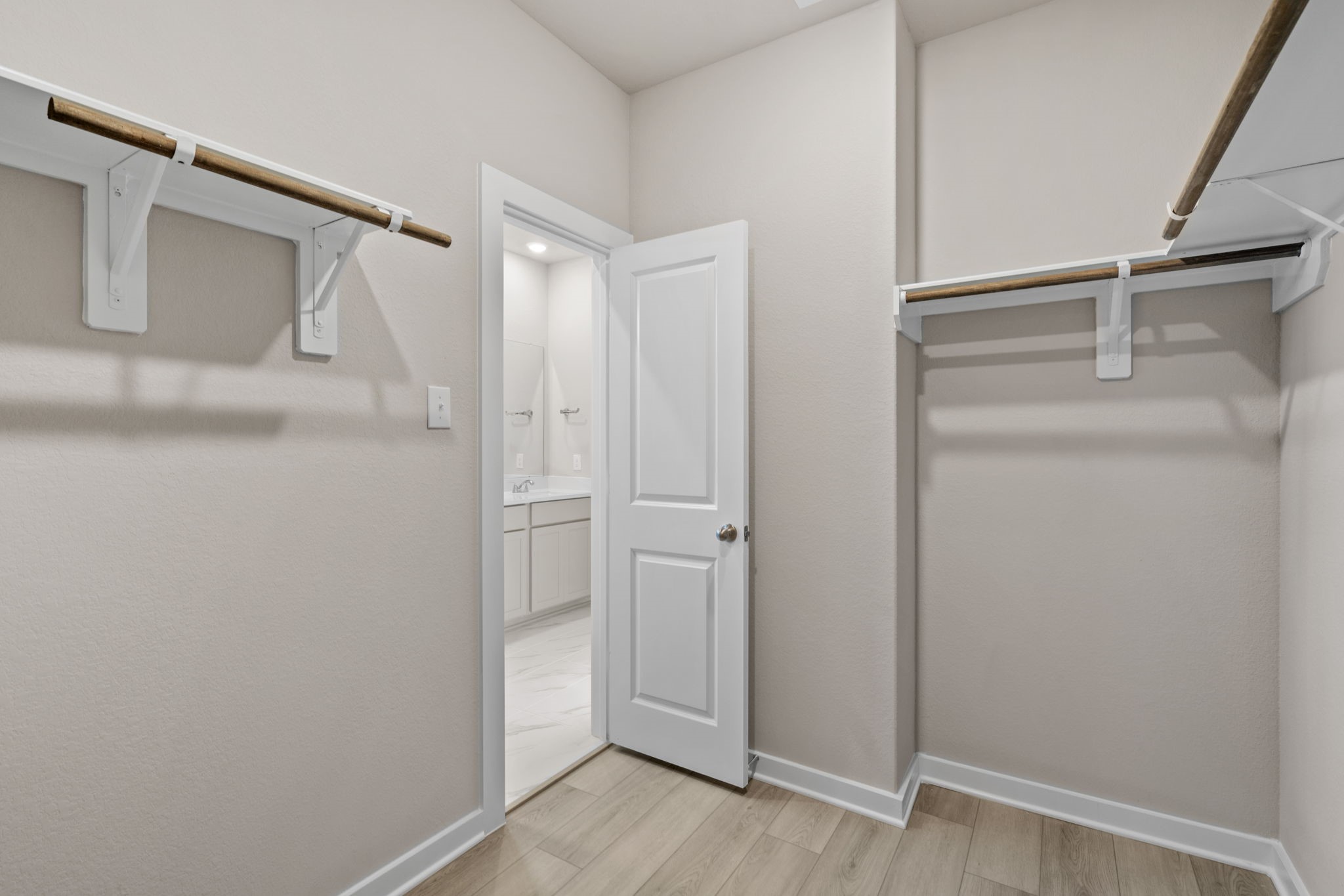 12015 Moonlight Path Drive Conroe, TX 77304 - Photo 21 of 31 a view of closet area with empty racks