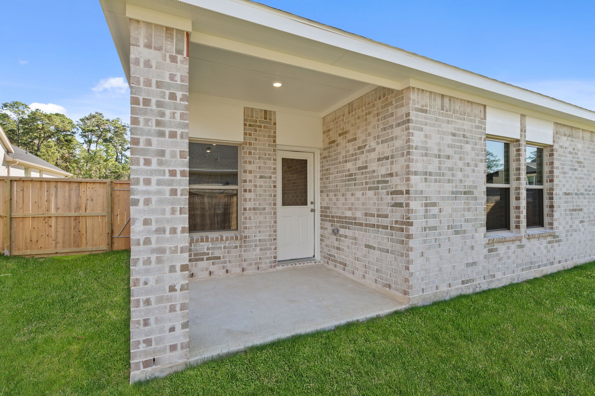 12015 Moonlight Path Drive Conroe, TX 77304 - Photo 25 of 31 a view of front door of house with yard