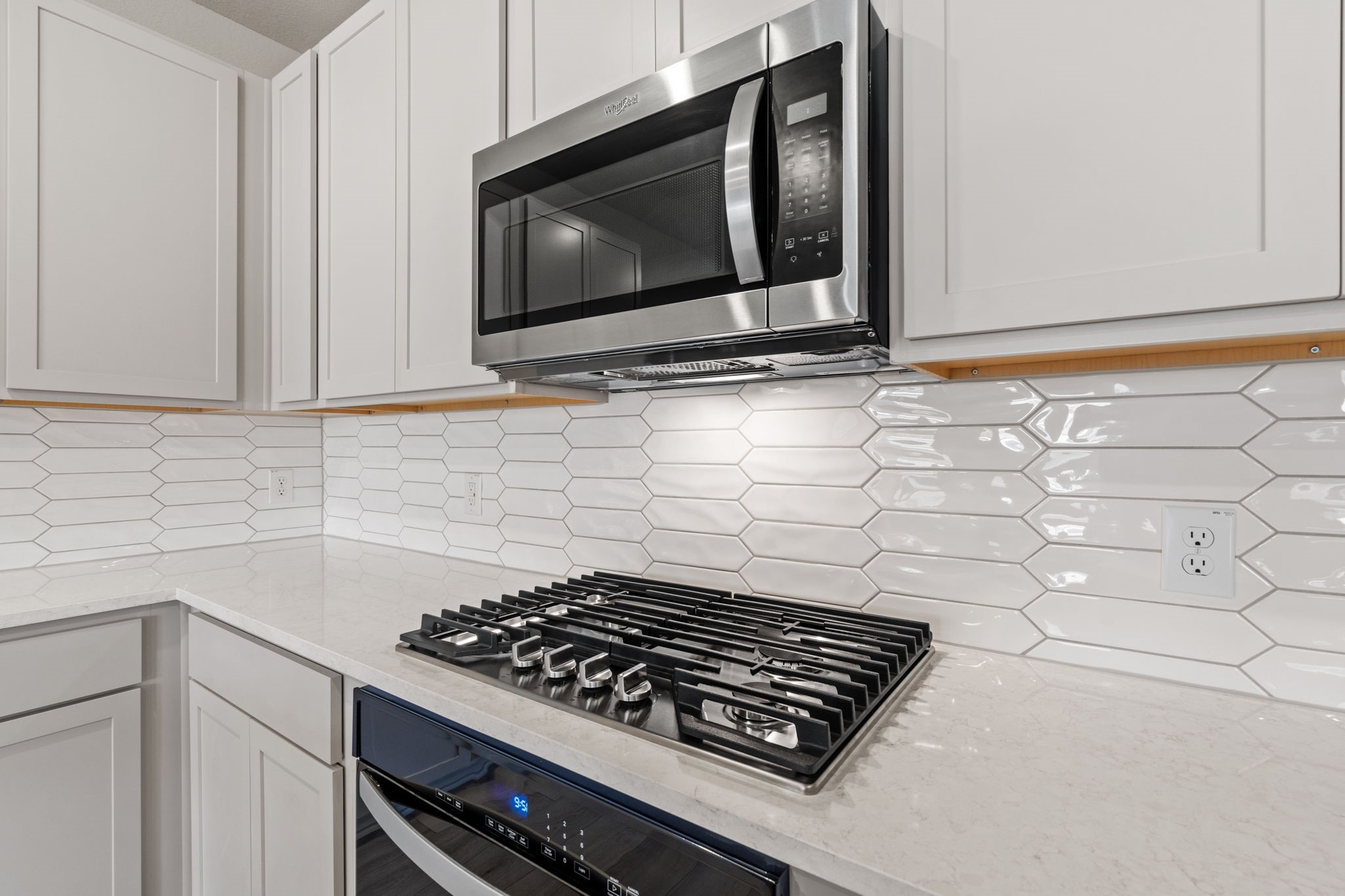 12015 Moonlight Path Drive Conroe, TX 77304 - Photo 6 of 31 a stove top oven sitting inside of a kitchen