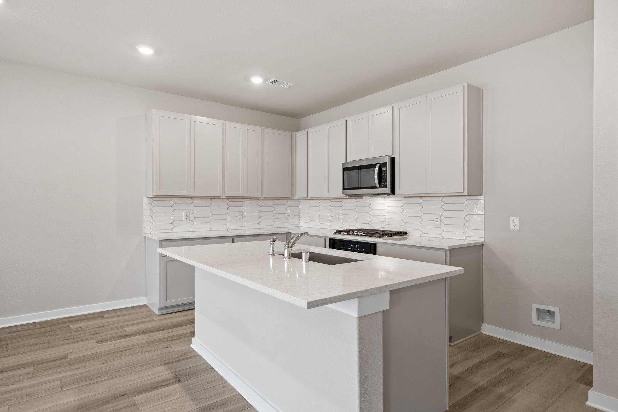 12015 Moonlight Path Drive Conroe, TX 77304 - Photo 7 of 31 a utility room with cabinets washer and dryer