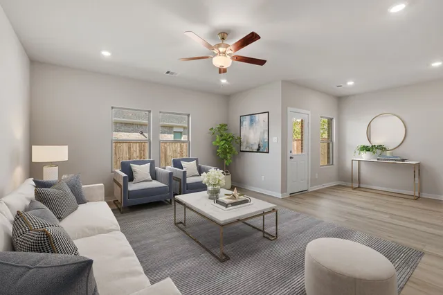 a living room with furniture and a large window