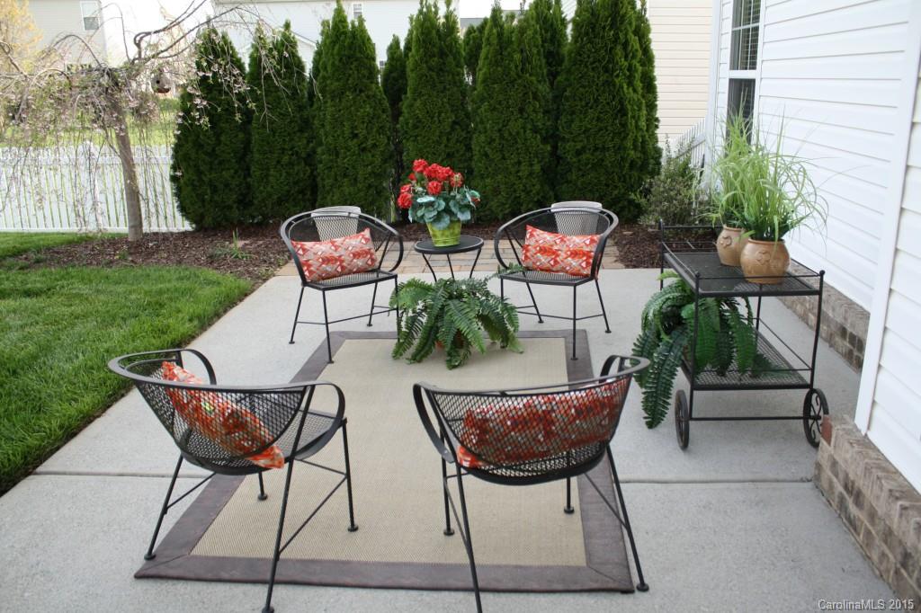6418 Hermsley Road Charlotte, NC 28278 - Photo 2 of 22 a view of a chairs and table in the back yard of the house