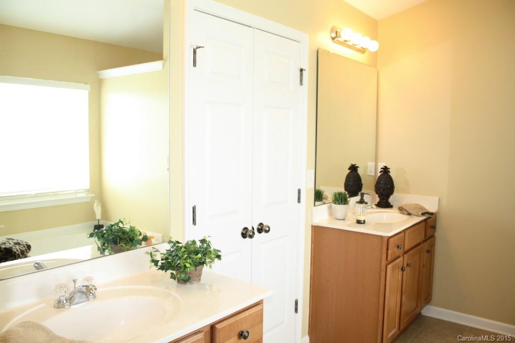 6418 Hermsley Road Charlotte, NC 28278 - Photo 12 of 22 a bathroom with a sink and a mirror
