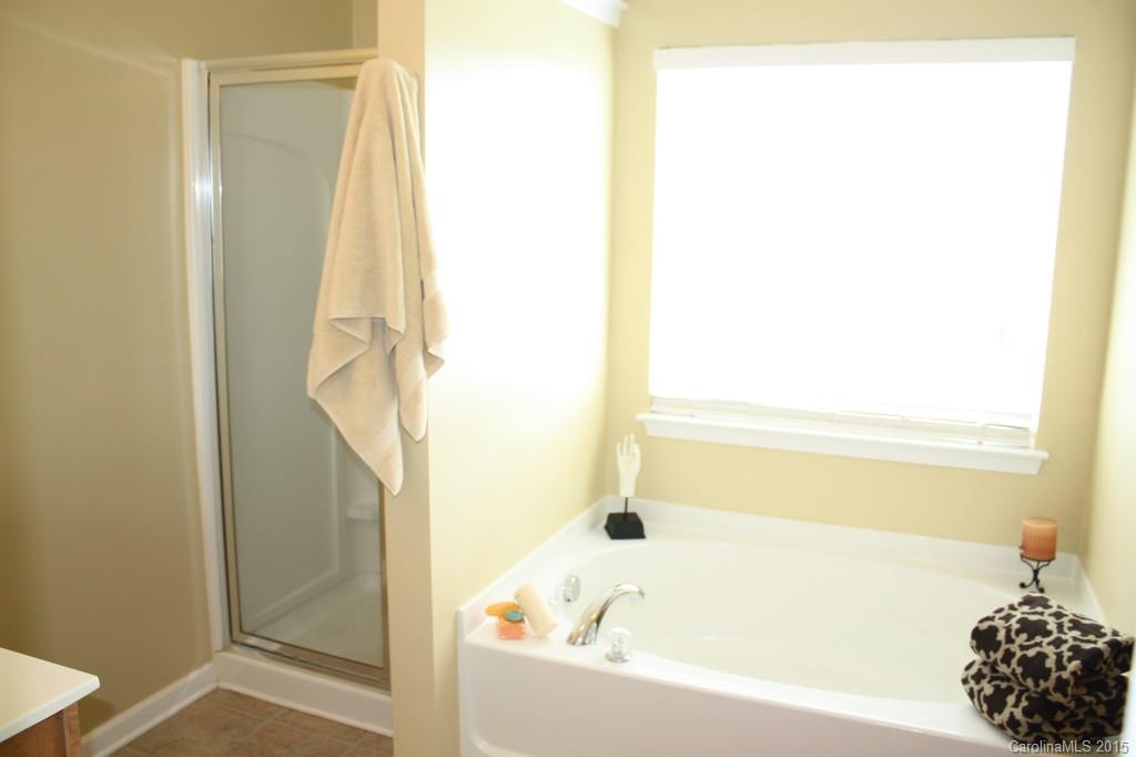 6418 Hermsley Road Charlotte, NC 28278 - Photo 13 of 22 a bathroom with a tub and shower