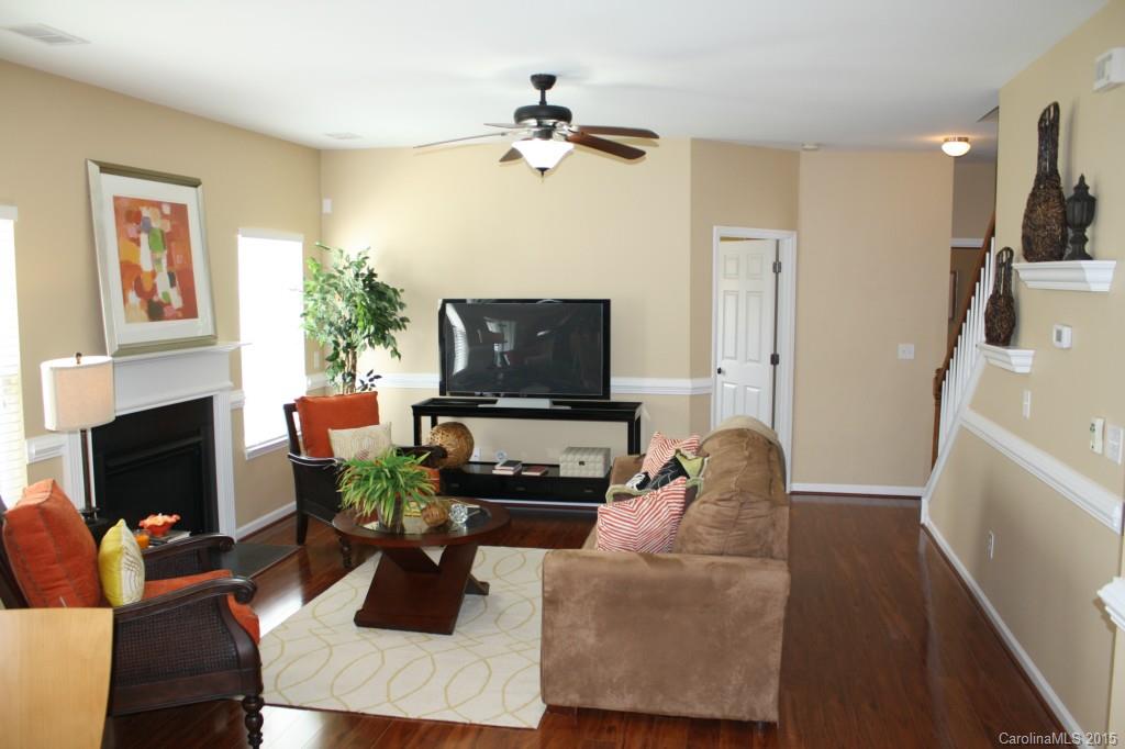 6418 Hermsley Road Charlotte, NC 28278 - Photo 6 of 22 a living room with furniture and a fireplace