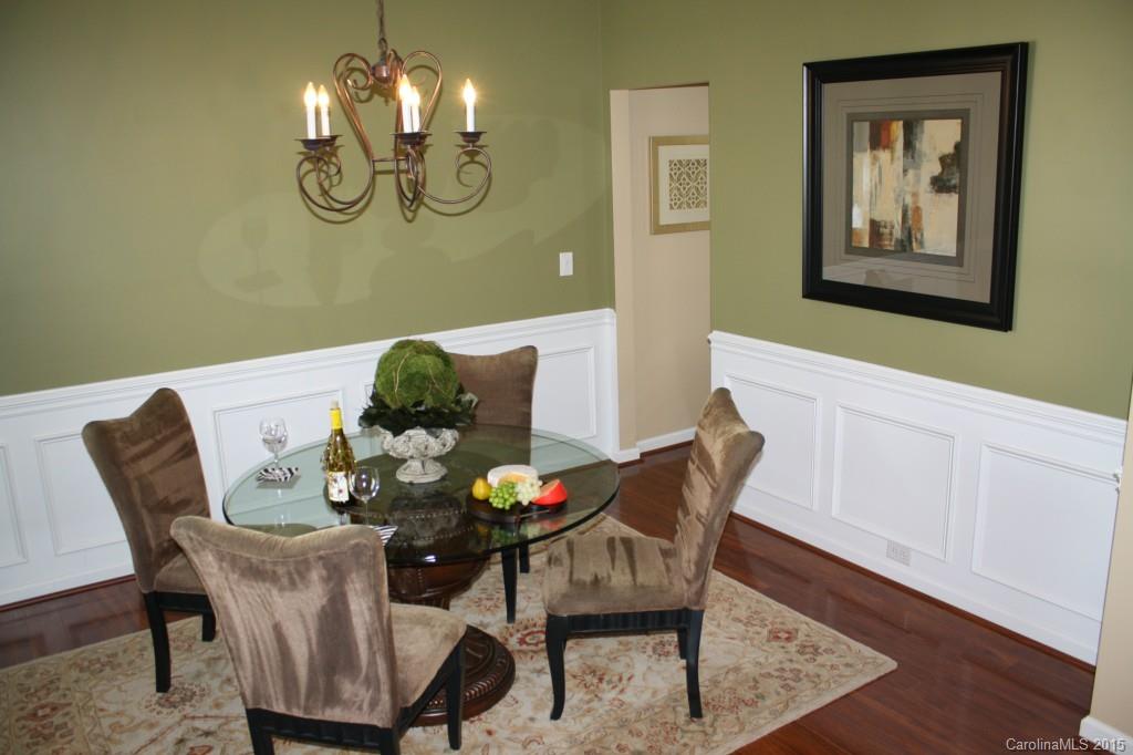 6418 Hermsley Road Charlotte, NC 28278 - Photo 7 of 22 a view of a dining room with furniture and chandelier