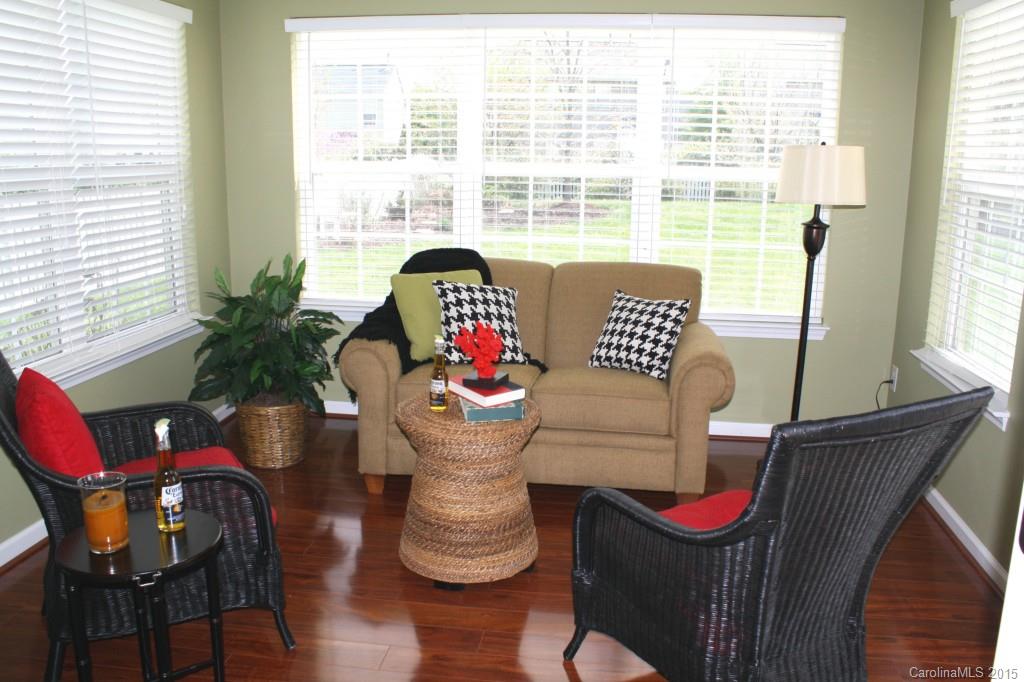 6418 Hermsley Road Charlotte, NC 28278 - Photo 8 of 22 a view of a dining room with furniture window and wooden floor