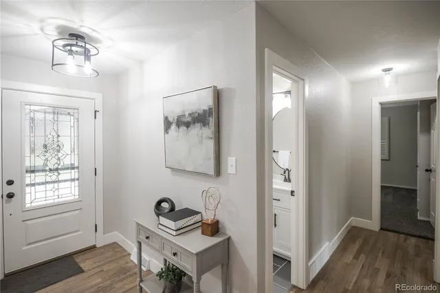 a workspace with wooden floor and a window