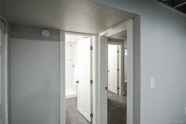 a view of a bathroom from a hallway