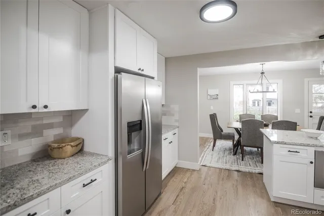 a kitchen with a table and chairs