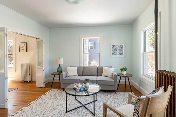 a living room with furniture and a window