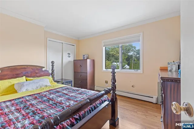 a bed room with a bed and a window