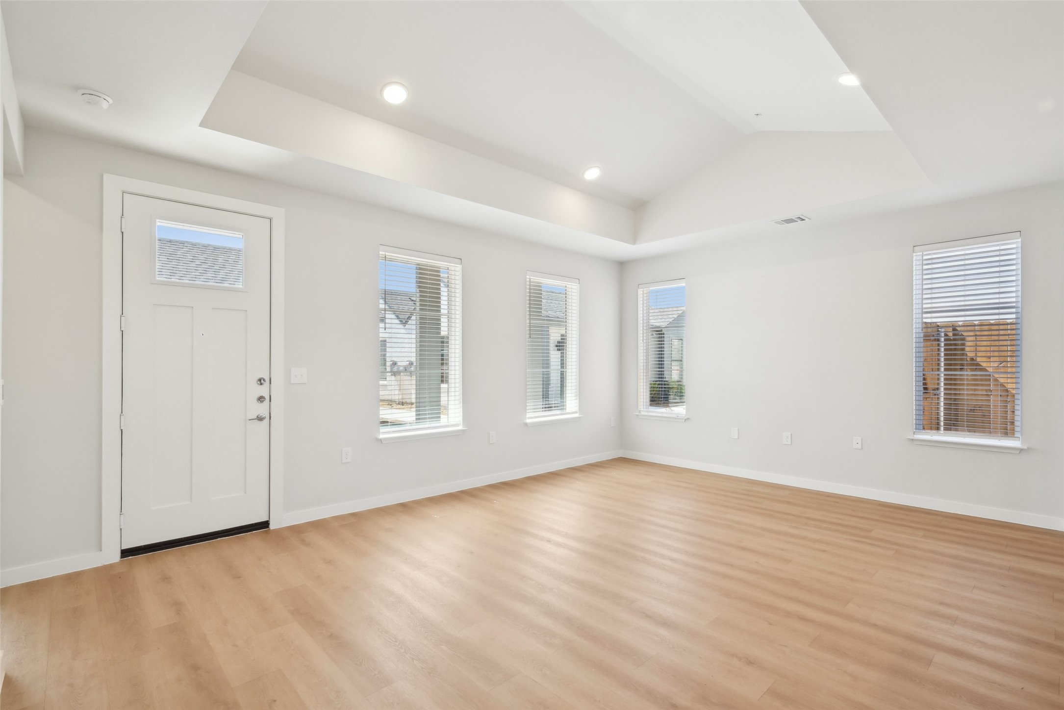 3651-205 South Custer Road McKinney, TX 75070 - Photo 6 of 25 an empty room with wooden floor and windows
