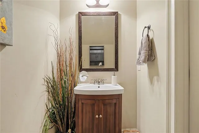 a bathroom with a sink and mirror