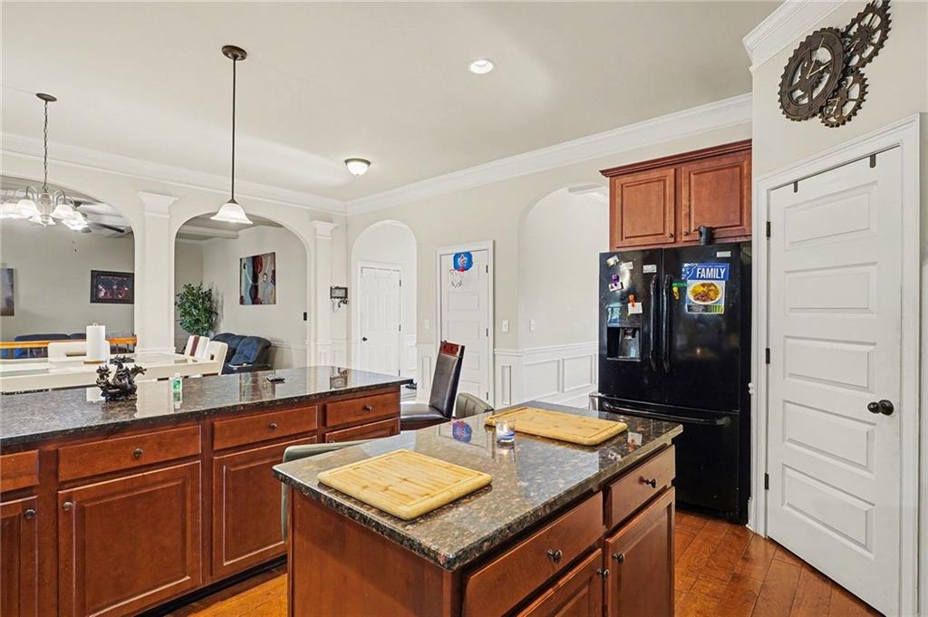 560 Aerial Avenue Stockbridge, GA 30281 - Photo 8 of 35 a kitchen with stainless steel appliances granite countertop a sink a refrigerator and a stove