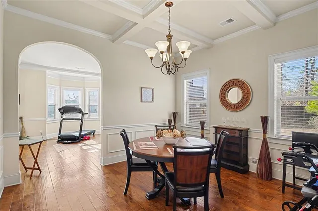 a view of a dining room with furniture window and wooden floor