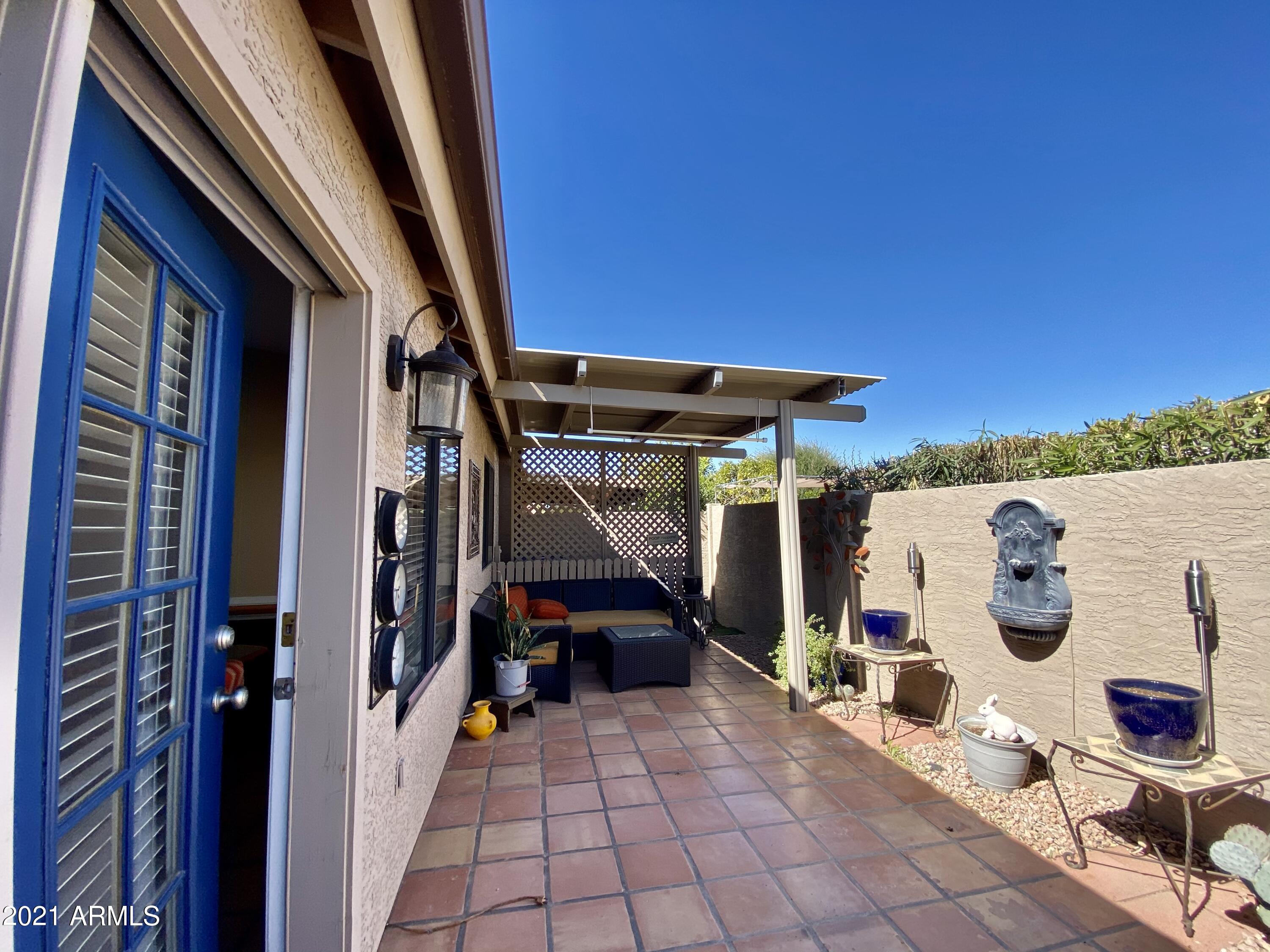 2329 North Recker Road, Unit 90 Mesa, AZ 85215 - Photo 20 of 22 Covered patio with moveable louvers