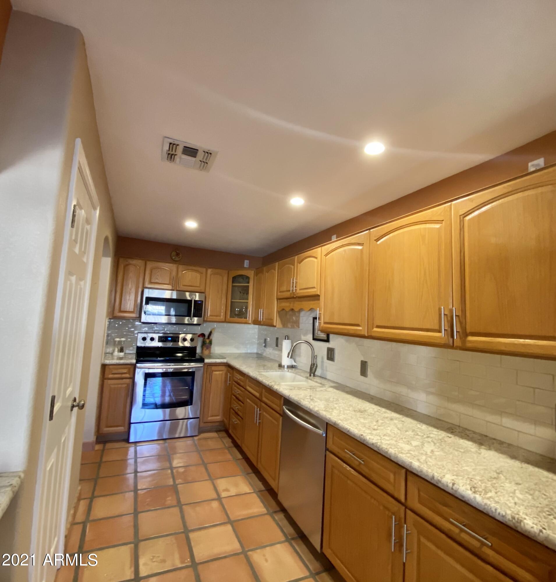 2329 North Recker Road, Unit 90 Mesa, AZ 85215 - Photo 4 of 22 Sleek gorgeous granite countertops