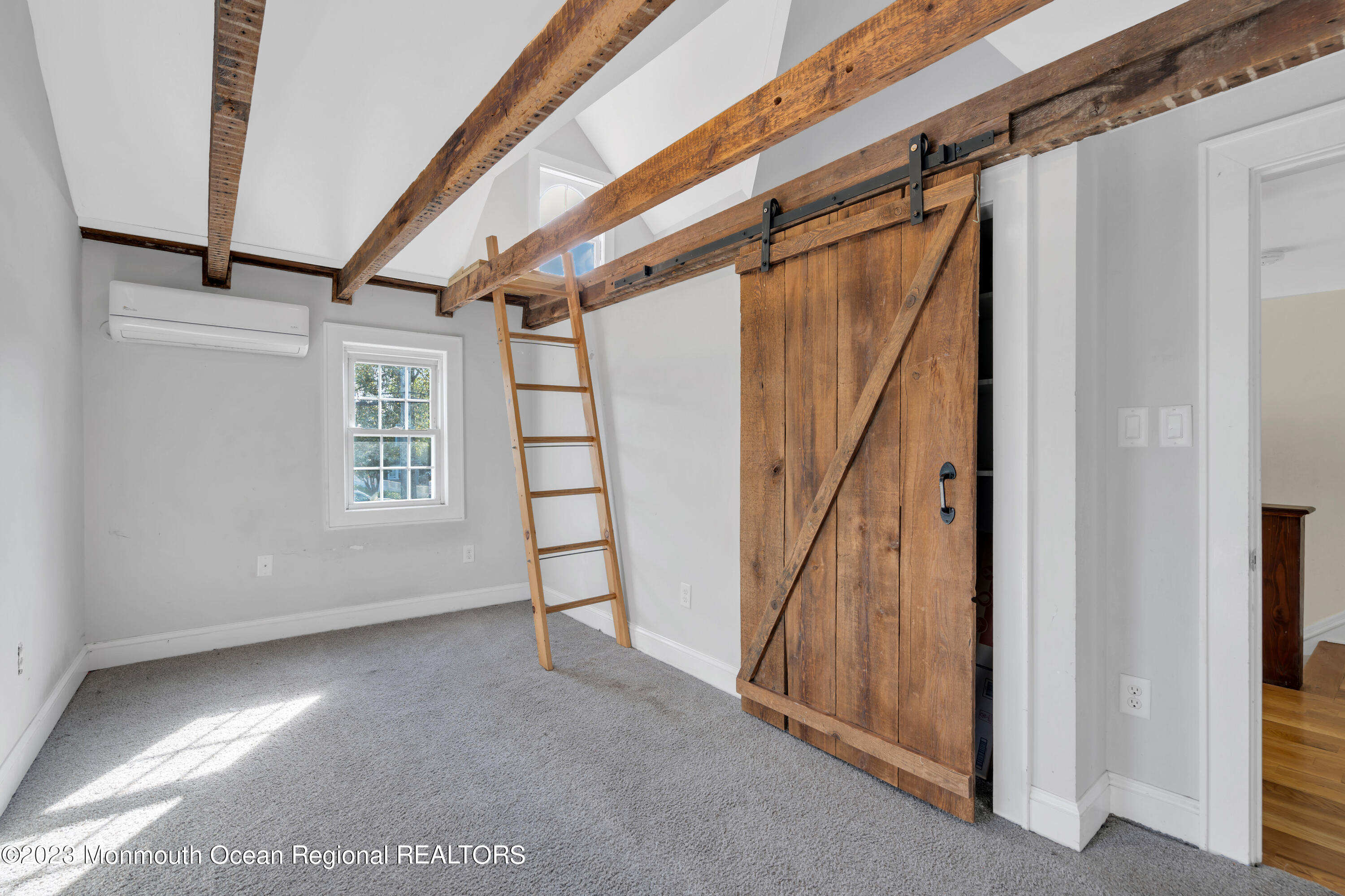 803 Ocean Road Point Pleasant, NJ 08742 - Photo 17 of 43 a view of an empty room with stairs