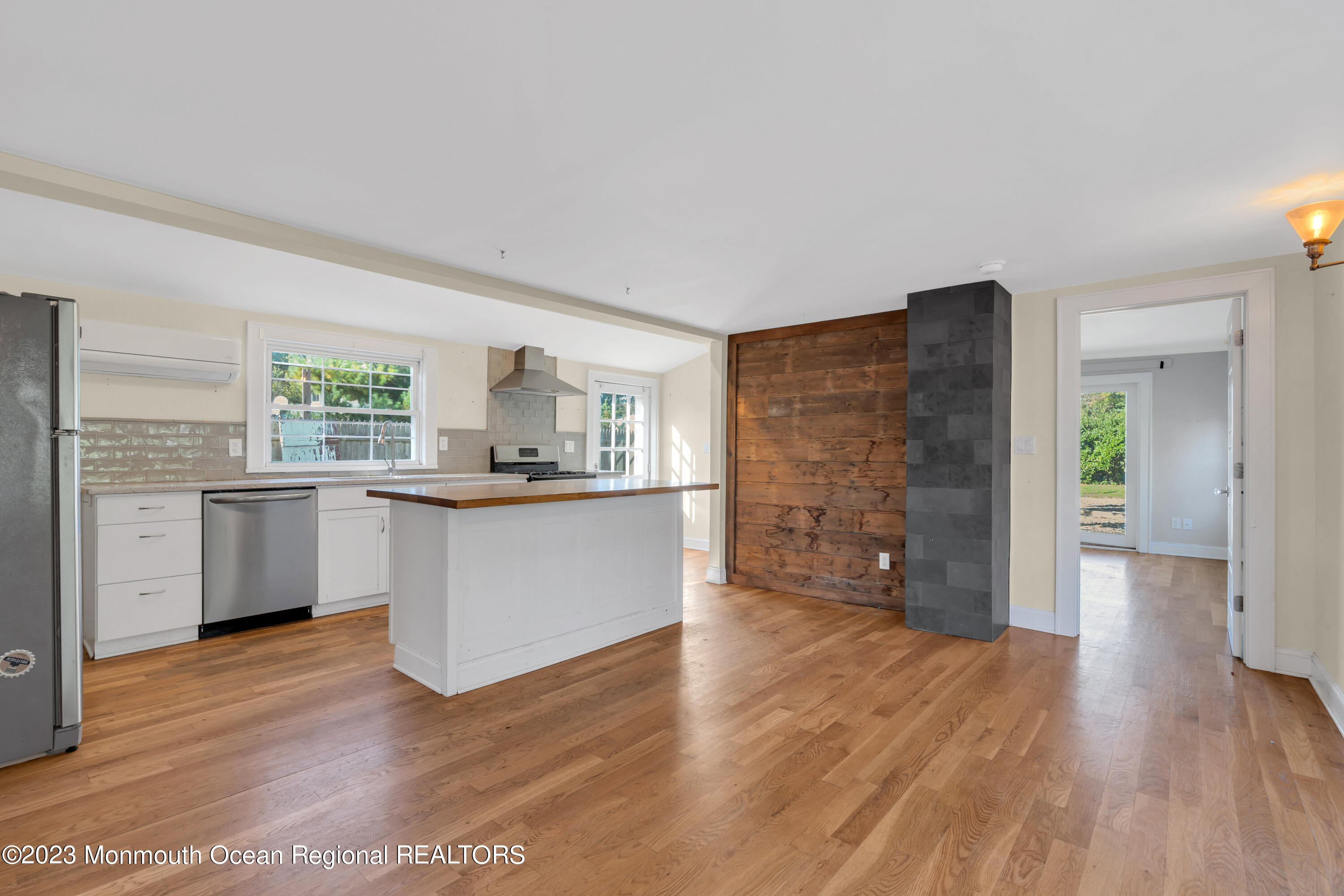 803 Ocean Road Point Pleasant, NJ 08742 - Photo 9 of 43 a view of kitchen with kitchen island wooden floors and stainless steel appliances