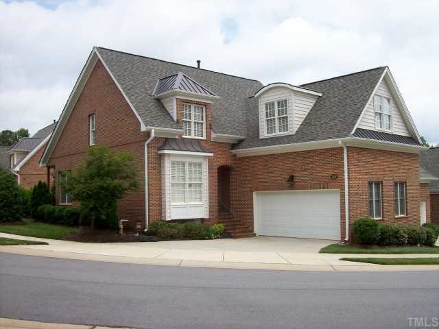 7335 Fontana Ridge Lane Raleigh, NC 27613 - Photo 1 of 12 a front view of a house with a yard and garage