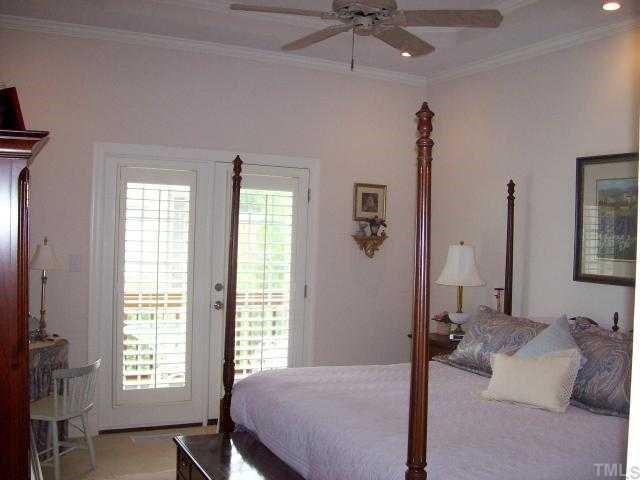 7335 Fontana Ridge Lane Raleigh, NC 27613 - Photo 7 of 12 a bedroom with a bed and a window