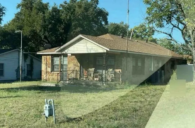 a house with trees in the background