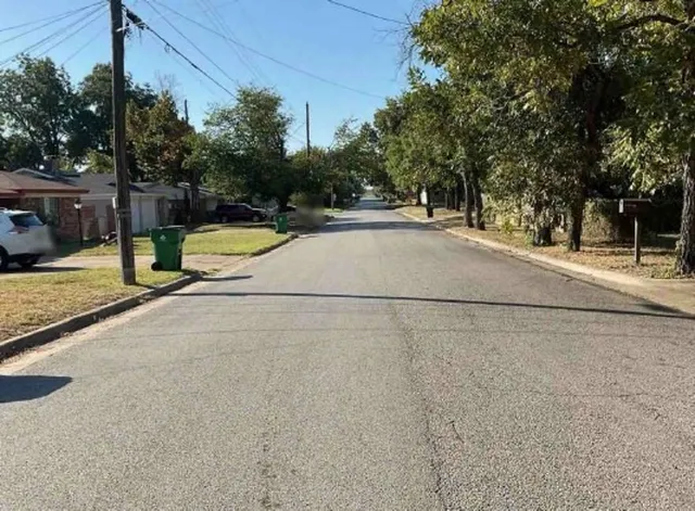 a view of a swimming pool with a house
