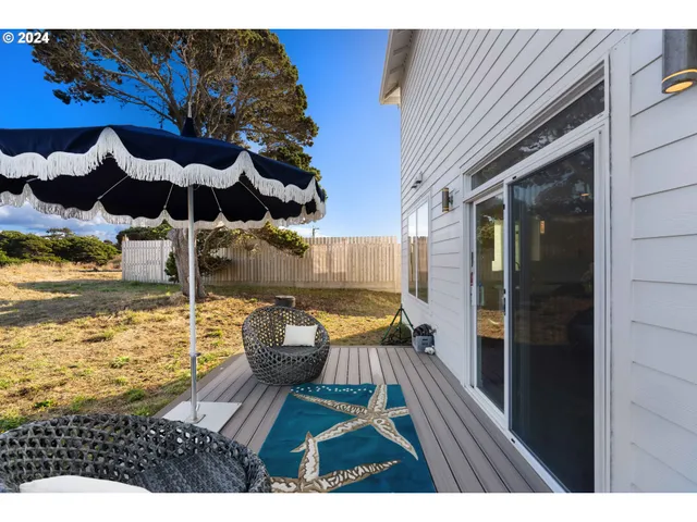 a view of a balcony with chair and the potted plant