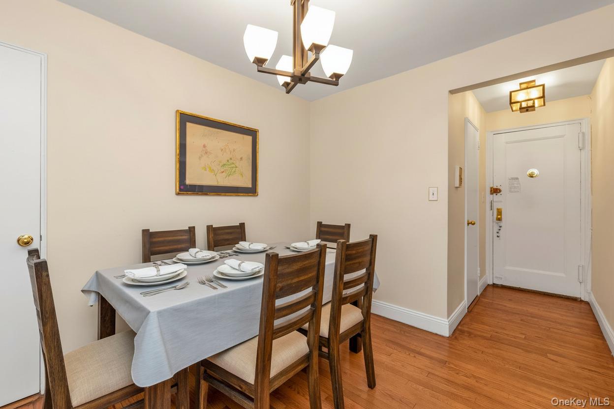 102-25 67th Road, Unit 4C Queens, NY 11375 - Photo 7 of 16 a view of a dining room with furniture and wooden floor