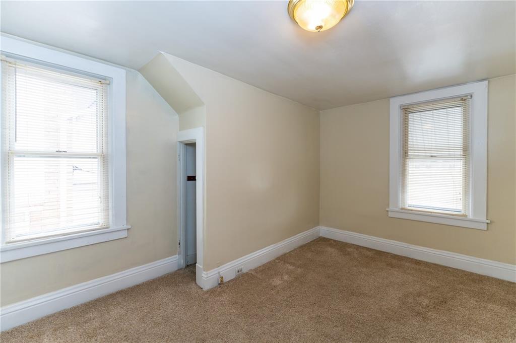 451 Ohio Avenue Rochester, PA 15074 - Photo 12 of 17 an empty room with windows and closet
