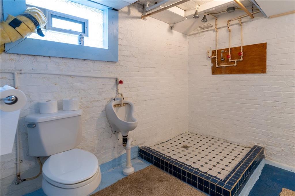 451 Ohio Avenue Rochester, PA 15074 - Photo 15 of 17 a bathroom with a toilet a sink and mirror