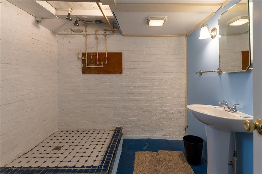 451 Ohio Avenue Rochester, PA 15074 - Photo 16 of 17 a bathroom with a sink a toilet and mirror