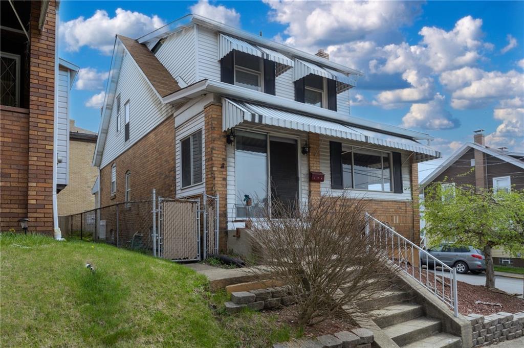 451 Ohio Avenue Rochester, PA 15074 - Photo 2 of 17 a front view of a house with garden