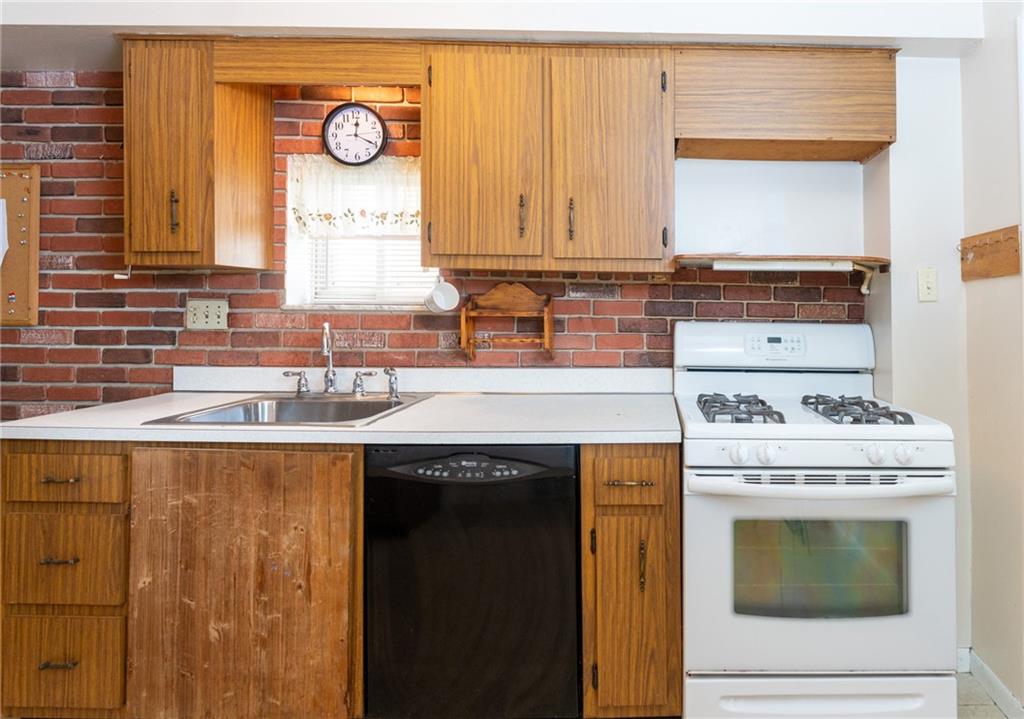 451 Ohio Avenue Rochester, PA 15074 - Photo 7 of 17 a stove top oven sitting inside of a kitchen