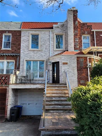 a front view of a house with stairs