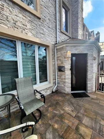 a view of a two chairs in the patio