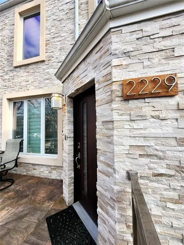 a brick building with a door and a window