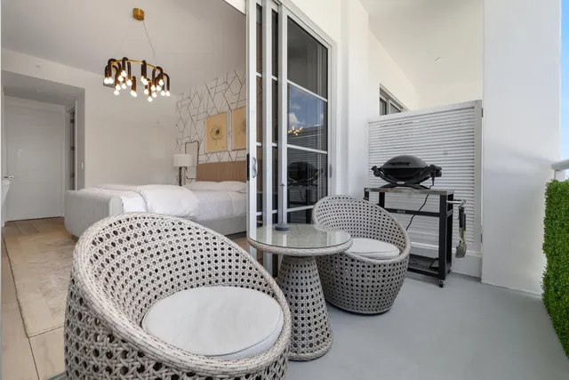 a bedroom with bed and a couch