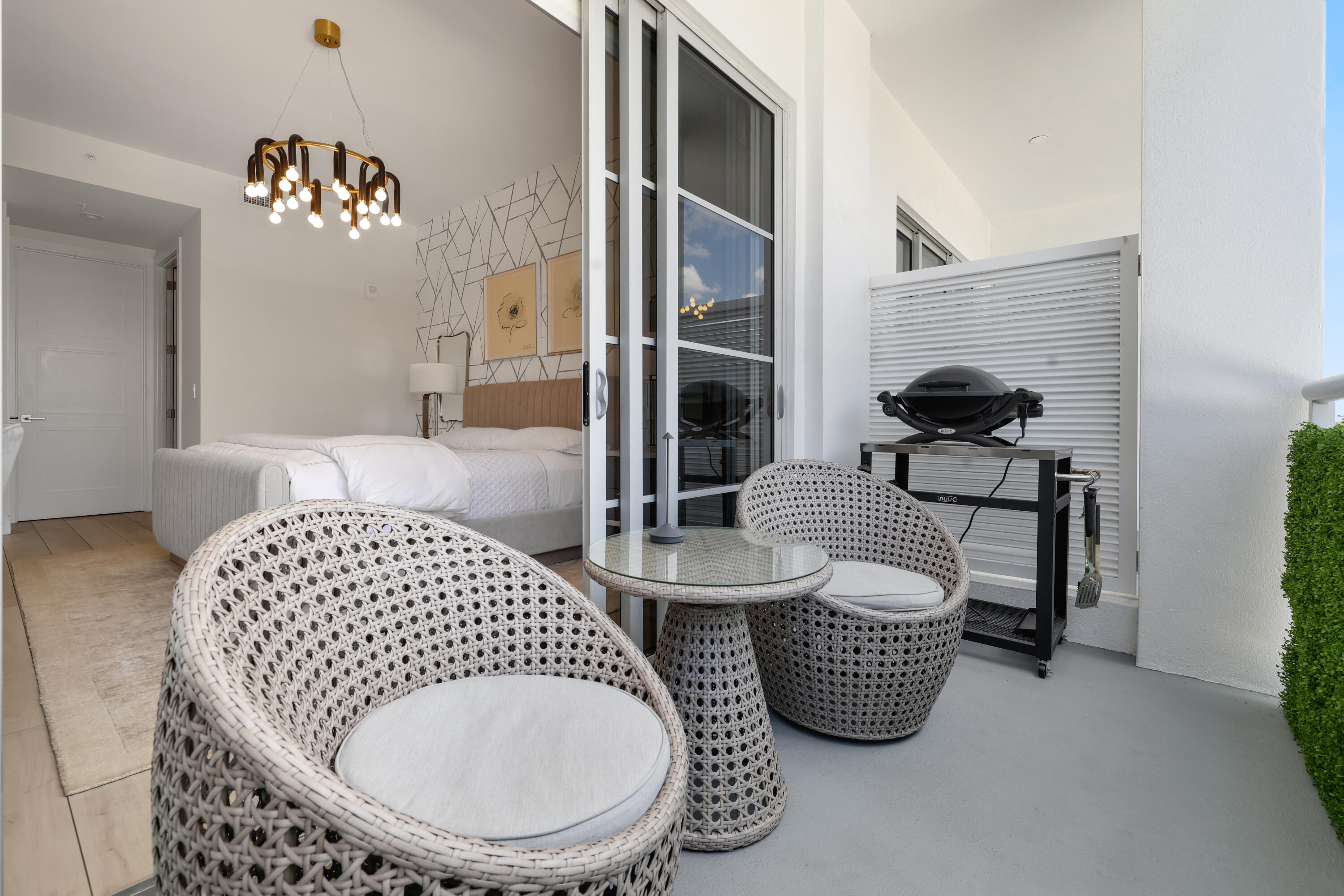 155 East Boca Raton Road, Unit 413 Boca Raton, FL 33432 - Photo 21 of 28 a bedroom with bed and a couch