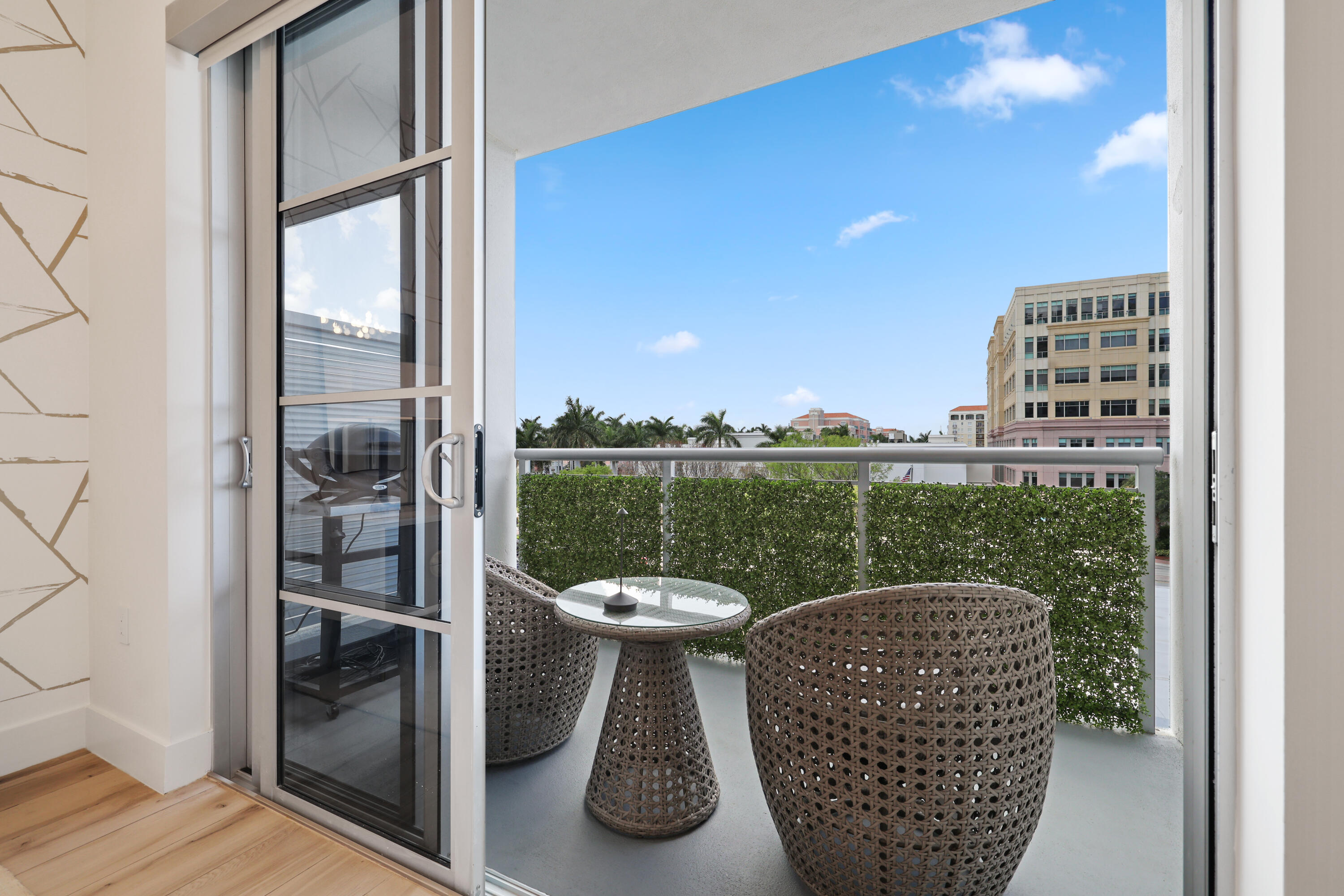 155 East Boca Raton Road, Unit 413 Boca Raton, FL 33432 - Photo 22 of 28 a view of a balcony with chair and dining table view