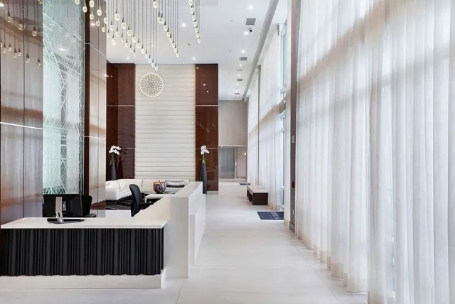 a view of a bathroom with a bathtub and a sink