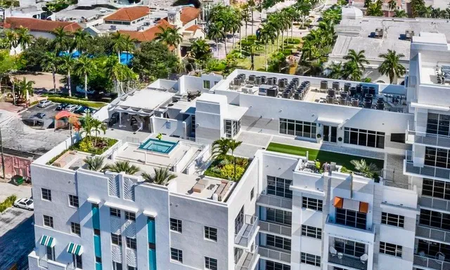 an aerial view of multi story residential apartment building