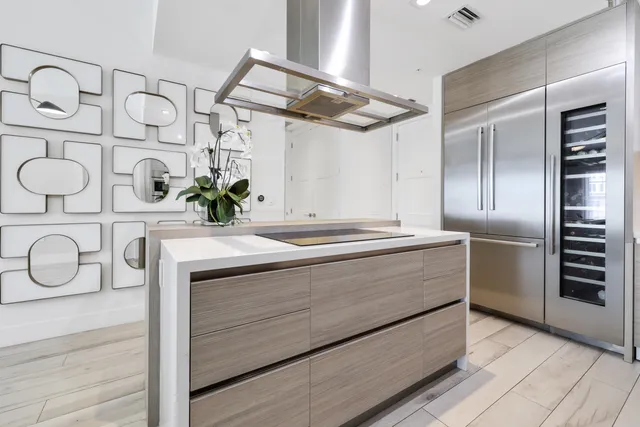 a view of a refrigerator and a sink
