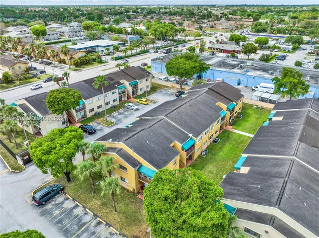 an aerial view of a house with a garden