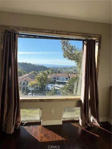 a view of a room with a large window