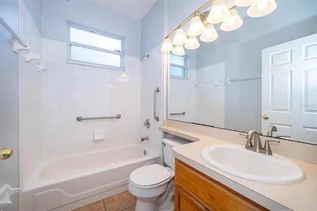 a bathroom with a sink a toilet and a bathtub