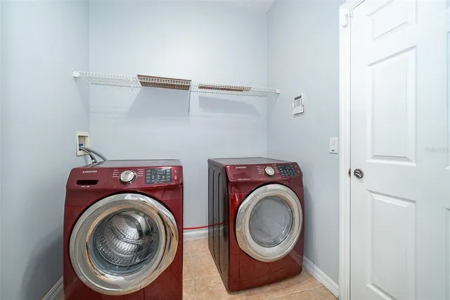 a utility room with dryer and washer